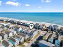 Aerial view of beach house community, highlighting the property's location and proximity to the ocean at 1514-A S Ocean Blvd., Surfside Beach, SC 29575