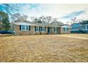 Brick ranch house with a landscaped yard at 155 Busbee St., Conway, SC 29526