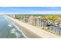 Expansive aerial showcasing oceanfront high-rise and surrounding area at 1690 N Waccamaw Dr. # 807, Murrells Inlet, SC 29576