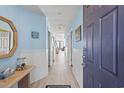 Bright hallway with light walls and wood-look floors at 1690 N Waccamaw Dr. # 807, Murrells Inlet, SC 29576