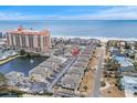 Complex of buildings near the beach with a pool and parking area at 1801 N Ocean Blvd. # F-1, North Myrtle Beach, SC 29582