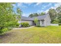 Landscaped lawn frames this lovely home, showcasing its well-maintained exterior and inviting curb appeal at 184 Retreat Pl., Little River, SC 29566