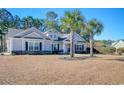 Attractive one-story house with gray siding and stone accents at 230 Kellys Cove Dr., Conway, SC 29526