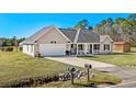 House with a large yard and driveway, seen from above at 2579 Allen Dew Rd., Conway, SC 29527