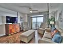 Comfortable living room with ocean view and hardwood floors at 2600 N Ocean Blvd. # 1410, Myrtle Beach, SC 29577