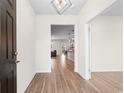 Bright entryway with dark hardwood floors and an open view into the living area at 3304 Candytuft Dr., Conway, SC 29526