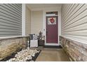 Inviting front entrance with a red door and stone accents at 331 Golan Circle # A, Myrtle Beach, SC 29579