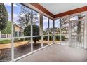 Enjoy outdoor living on this screened porch with views of the private, landscaped backyard at 4660 Lightkeepers Way # 37A, Little River, SC 29566