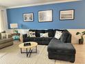 Spacious living room with sectional sofa and coastal decor at 4811 Magnolia Lake Dr. # 105, Myrtle Beach, SC 29577