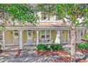 Two-story home with front porch and landscaping at 4910 N Market St. # M9-R2, North Myrtle Beach, SC 29582