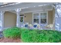 Relaxing front porch with rocking chairs and swing at 4910 N Market St. # M9-R2, North Myrtle Beach, SC 29582