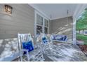 Front porch with rocking chairs and swing at 4910 N Market St. # M9-R2, North Myrtle Beach, SC 29582