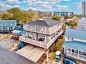 Two-story beach house with spacious deck and golf cart parking at 6001 - 6004 S Kings Hwy., Myrtle Beach, SC 29575