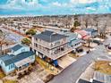 Beach house view showing home's elevated position and parking at 6001 - 6004 S Kings Hwy., Myrtle Beach, SC 29575