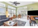 Relaxing sunroom with wicker furniture and access to patio at 6925 Ashley Cove Dr., Myrtle Beach, SC 29588