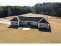 Single-story home with a large yard and ample parking at 798 Blue Sky Rd, Loris, SC 29569