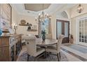 Formal dining room with a rustic wooden table and chandelier at 8058 Verona Dr., Myrtle Beach, SC 29572