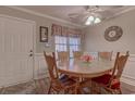 Round wooden dining table with four chairs at 880 Fairway Dr. # 302Bb, Longs, SC 29568