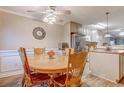 Kitchen and dining area with table and chairs at 880 Fairway Dr. # 302Bb, Longs, SC 29568