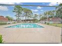 Community swimming pool with chain link fence at 1025 Carolina Rd. # H4, Conway, SC 29526