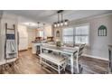 Bright dining area with a farmhouse table and bench seating at 1100 Naomi Ave., Conway, SC 29526