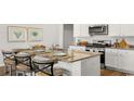 Kitchen island with granite countertop and seating for four at 120 Shucking St., Myrtle Beach, SC 29588