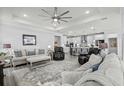 Cozy living room with comfortable seating, a ceiling fan, recessed lighting, and neutral decor at 1410 Saw Palmetto St., North Myrtle Beach, SC 29582