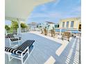 Ocean view deck with chairs and tables at 1524 S Ocean Blvd. S # Penthouse, North Myrtle Beach, SC 29582