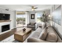 Bright living room featuring hardwood floors, fireplace, and balcony access at 1819 North Ocean Blvd. # 8015, North Myrtle Beach, SC 29582