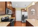 Modern kitchen featuring granite countertops and hardwood floors at 1901-B High St., Myrtle Beach, SC 29577