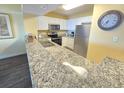 Kitchen with granite countertops and stainless steel appliances at 2007 S Ocean Blvd. # 1607, Myrtle Beach, SC 29577