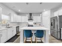 Modern kitchen with white cabinets, center island, and stainless steel appliances at 206 Calhoun Falls Dr., Myrtle Beach, SC 29579