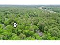 This home is a serene retreat, tucked away in a beautiful forest, offering peace and quiet at 2102 Calabash Circle, Little River, SC 29566