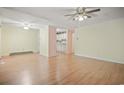 Spacious living room featuring hardwood floors and a peek into the bright kitchen at 2102 Calabash Circle, Little River, SC 29566