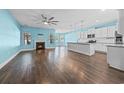 Bright living room with fireplace and hardwood floors at 3047 Honey Clover Ct., Longs, SC 29568