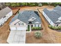 Attractive two-story house with a gray roof and two-car garage, viewed from above at 311 Highfield Loop, Myrtle Beach, SC 29579