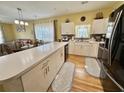 Open kitchen with white cabinets and stainless steel appliances at 3951 Gladiola Ct. # 204, Myrtle Beach, SC 29588