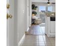 Hallway that leads to a living area with neutral paint and hardwood flooring, leading to an outdoor patio at 4413 Eastport Blvd. # F-6, Little River, SC 29566