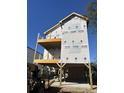 Under-construction beach home exterior with elevated foundation at 4617 Hedrick St., North Myrtle Beach, SC 29582