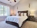 Main bedroom with a large window and carpeted floor at 49 Daniel Morrall Ln., Georgetown, SC 29440