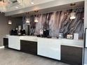 Modern hotel lobby with a marble-like reception desk and stylish lighting at 504 N Ocean Blvd. # 1003, Myrtle Beach, SC 29577