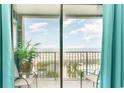 Bedroom features sliding glass doors opening to an ocean view balcony at 5905 S Kings Hwy. # A - 301, Myrtle Beach, SC 29575