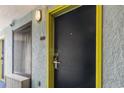 Hotel-style room entrance with a dark door and yellow trim at 6804 N Ocean Blvd. # 1117, Myrtle Beach, SC 29572