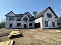 New home with a garage featuring exterior framing and wrapped for protection at 7053 Byrnes Ln., Myrtle Beach, SC 29588