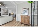 Bright entryway with hardwood floors and antique cabinet at 744 Crystal Water Way, Myrtle Beach, SC 29579