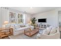 Bright living room with comfy sofas, a large window, and a neutral color scheme at 809 Green Garden Way, Myrtle Beach, SC 29579