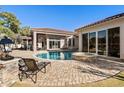 Inviting pool and spa surrounded by a brick patio; comfortable lounge chairs at 9237 Bellasara Circle, Myrtle Beach, SC 29579