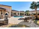 Relaxing poolside patio with fire pit and comfortable seating at 9237 Bellasara Circle, Myrtle Beach, SC 29579