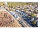 Aerial view of a community of houses with parking at 111 Addison Cottage Way, Murrells Inlet, SC 29576