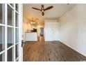 Open living room with hardwood floors and ceiling fan at 111 Addison Cottage Way, Murrells Inlet, SC 29576